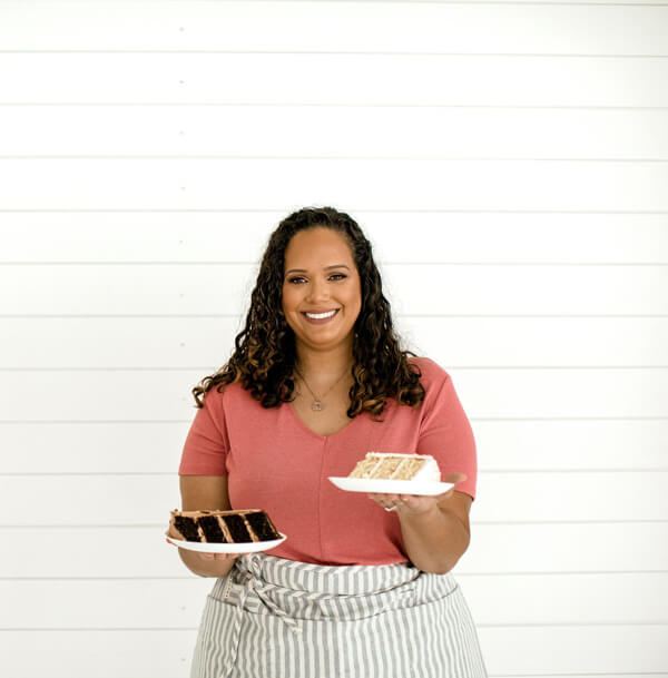 Magali holding plates of her treats