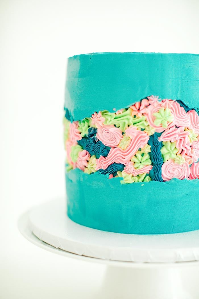 Teal buttercream cake with a hand-piped floral garden band